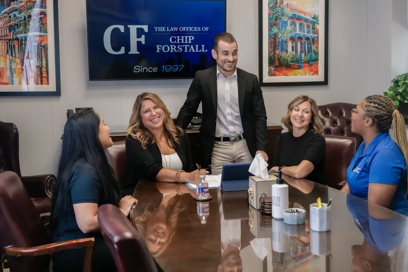 The team gathered around the conference table for a morning meeting