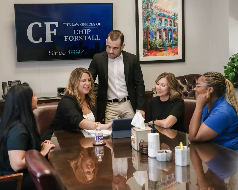 Two members of the firm going through a case file line by line