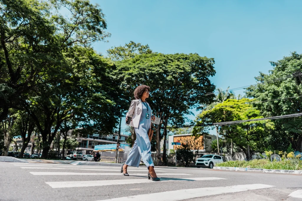 Woman walking across a crosswalk in New Orleans representing pedestrian accident and injury cases